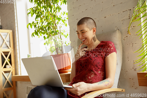 Image of Woman working from home during coronavirus or COVID-19 quarantine, remote office concept