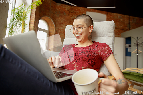 Image of Woman working from home during coronavirus or COVID-19 quarantine, remote office concept
