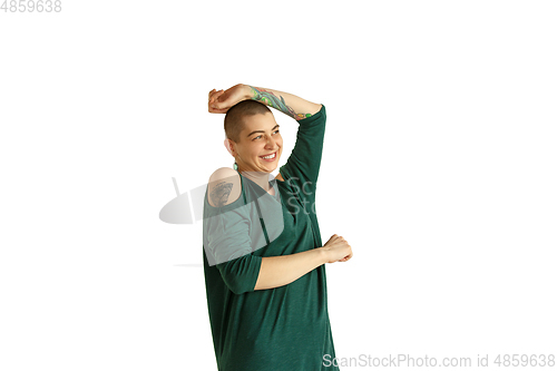 Image of Portrait of young woman with freaky appearance on white background