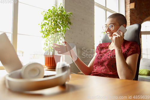 Image of Woman working from home during coronavirus or COVID-19 quarantine, remote office concept