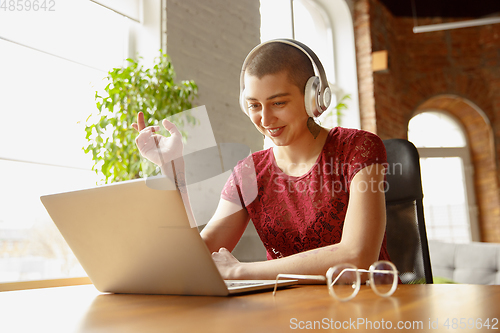 Image of Woman working from home during coronavirus or COVID-19 quarantine, remote office concept