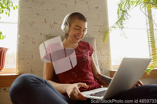 Image of Woman working from home during coronavirus or COVID-19 quarantine, remote office concept