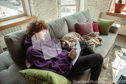 Image of Man working from home during coronavirus or COVID-19 quarantine, remote office concept