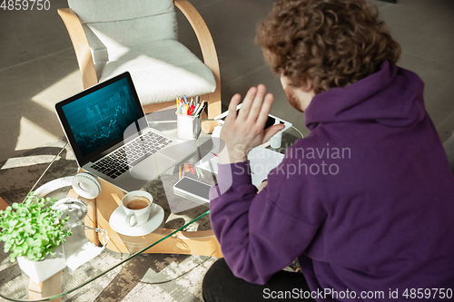 Image of Man working from home during coronavirus or COVID-19 quarantine, remote office concept