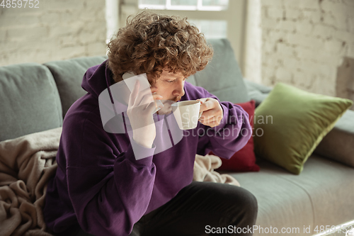 Image of Man working from home during coronavirus or COVID-19 quarantine, remote office concept