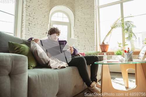 Image of Man working from home during coronavirus or COVID-19 quarantine, remote office concept