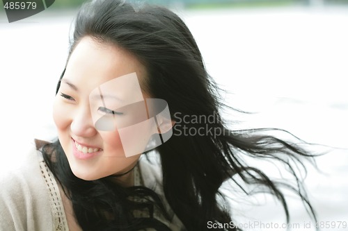 Image of beautiful orient girl on wind