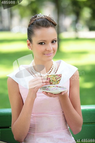 Image of beautiful smiling girl drink coffee