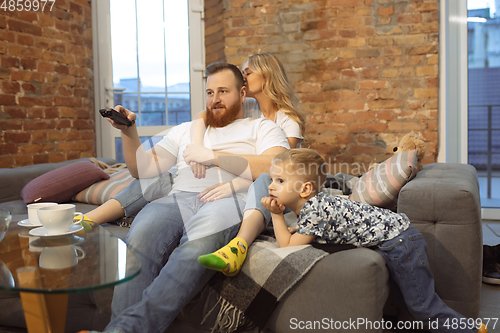 Image of Mother, father and son at home having fun, comfort and cozy concept