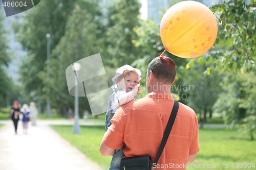 Image of small daughter on hand father