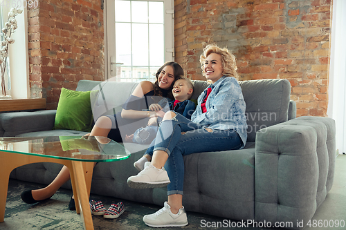 Image of Mother, son and sister at home having fun, comfort and cozy concept, celebrating birthday