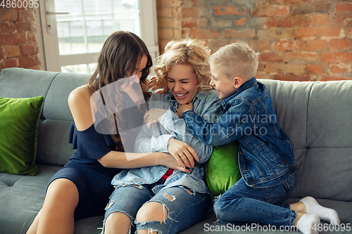 Image of Mother, son and sister at home having fun, comfort and cozy concept, celebrating birthday