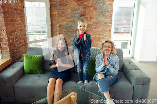 Image of Mother, son and sister at home having fun, comfort and cozy concept, celebrating birthday