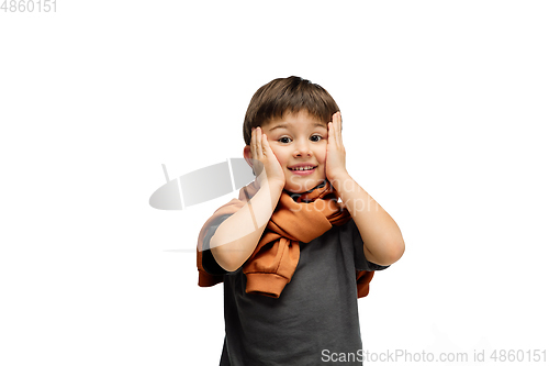 Image of Happy caucasian little boy isolated on white studio background. Looks happy, cheerful, sincere. Copyspace. Childhood, education, emotions concept