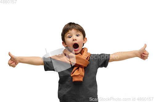 Image of Happy caucasian little boy isolated on white studio background. Looks happy, cheerful, sincere. Copyspace. Childhood, education, emotions concept