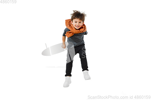 Image of Happy caucasian little boy isolated on white studio background. Looks happy, cheerful, sincere. Copyspace. Childhood, education, emotions concept