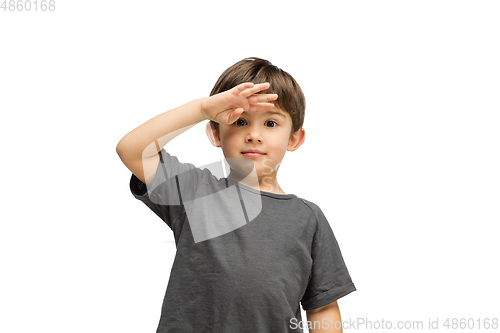 Image of Happy caucasian little boy isolated on white studio background. Looks happy, cheerful, sincere. Copyspace. Childhood, education, emotions concept