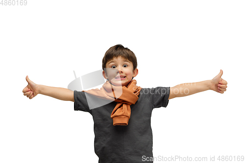 Image of Happy caucasian little boy isolated on white studio background. Looks happy, cheerful, sincere. Copyspace. Childhood, education, emotions concept