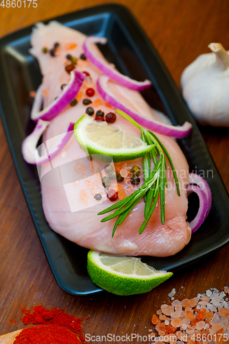 Image of fresh organic chicken breast with herbs and spices