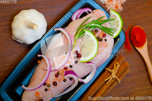 Image of fresh organic chicken breast with herbs and spices