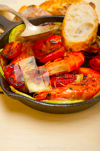 Image of roasted shrimps with zucchini and tomatoes