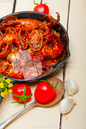 Image of fresh seafoos stew on an iron skillet