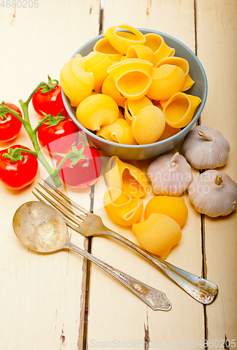 Image of Italian snail lumaconi pasta with tomatoes