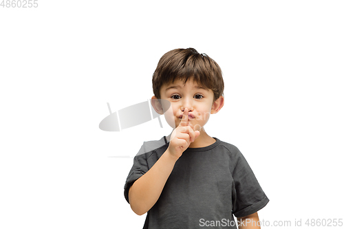 Image of Happy caucasian little boy isolated on white studio background. Looks happy, cheerful, sincere. Copyspace. Childhood, education, emotions concept