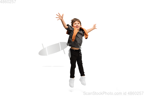 Image of Happy caucasian little boy isolated on white studio background. Looks happy, cheerful, sincere. Copyspace. Childhood, education, emotions concept