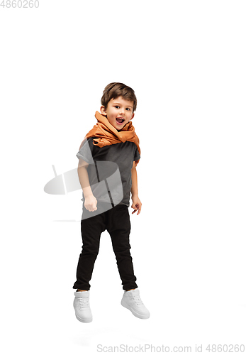 Image of Happy caucasian little boy isolated on white studio background. Looks happy, cheerful, sincere. Copyspace. Childhood, education, emotions concept