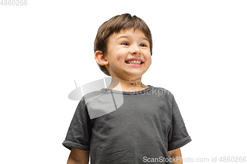 Image of Happy caucasian little boy isolated on white studio background. Looks happy, cheerful, sincere. Copyspace. Childhood, education, emotions concept