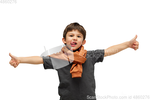 Image of Happy caucasian little boy isolated on white studio background. Looks happy, cheerful, sincere. Copyspace. Childhood, education, emotions concept