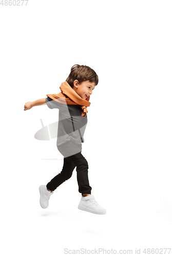 Image of Happy caucasian little boy isolated on white studio background. Looks happy, cheerful, sincere. Copyspace. Childhood, education, emotions concept