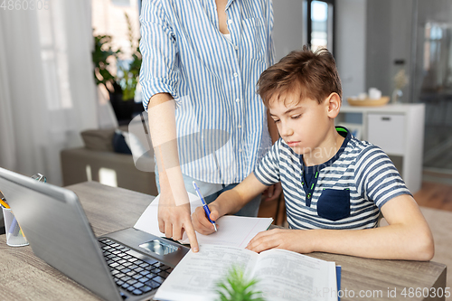 Image of mother and son doing homework together