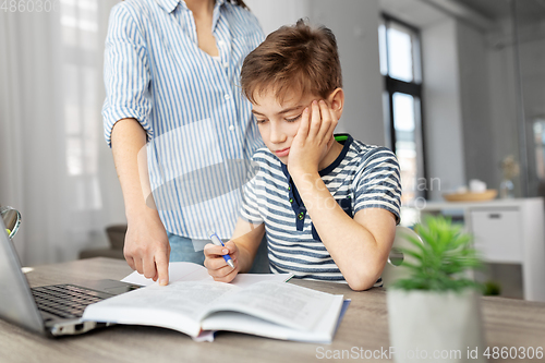 Image of mother and son doing homework together