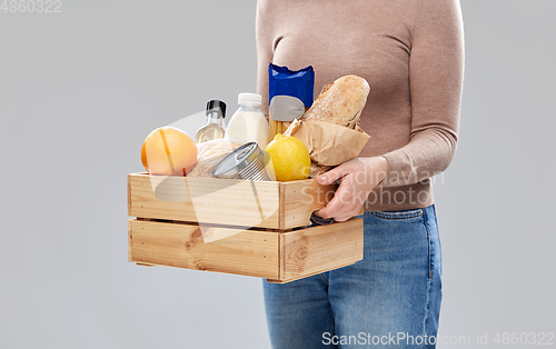 Image of close up of woman with food in wooden box