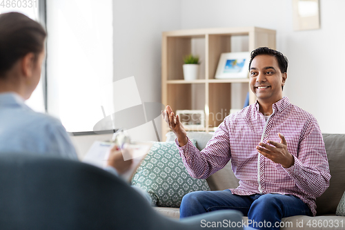 Image of man and psychologist at psychotherapy session