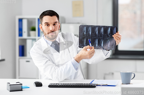 Image of doctor with x-ray having video call at clinic