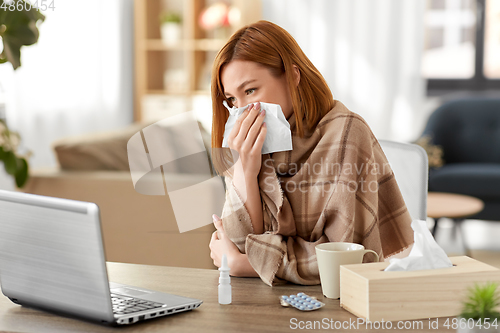 Image of sick woman having video call on tablet pc at home