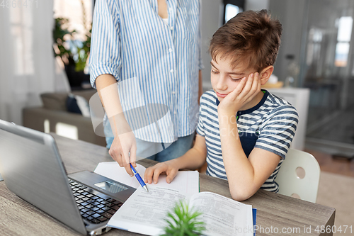 Image of mother and son doing homework together