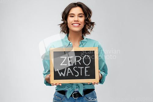 Image of happy woman with chalkboard with zero waste words