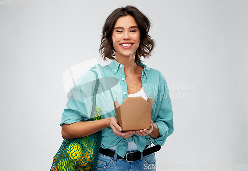 Image of happy woman with food in reusable net bag and wok