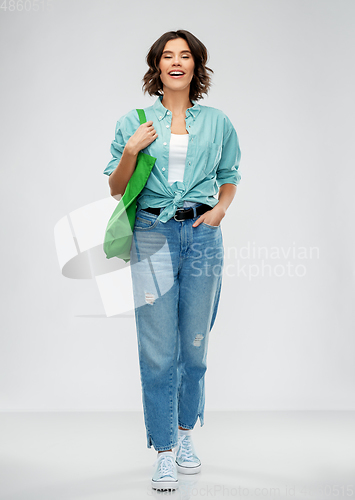 Image of woman with reusable canvas bag for food shopping