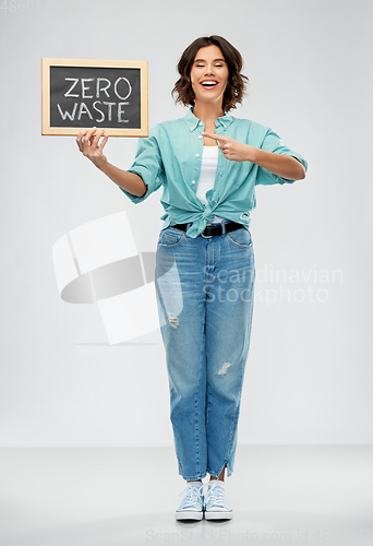 Image of happy woman with chalkboard with zero waste words