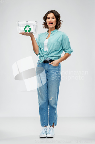 Image of smiling young woman sorting metallic waste