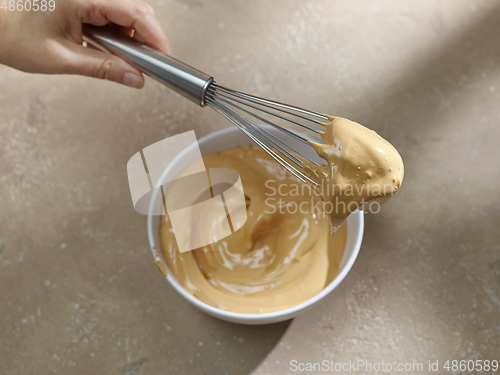 Image of bowl of whipped instant coffee with sugar and water