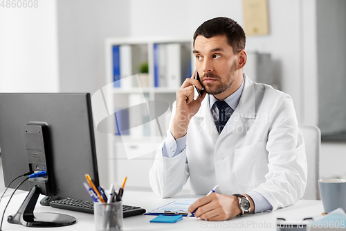 Image of male doctor calling on phone at hospital