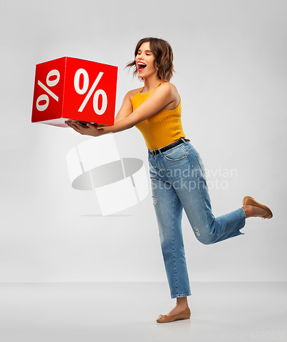 Image of happy smiling young woman with sale sign