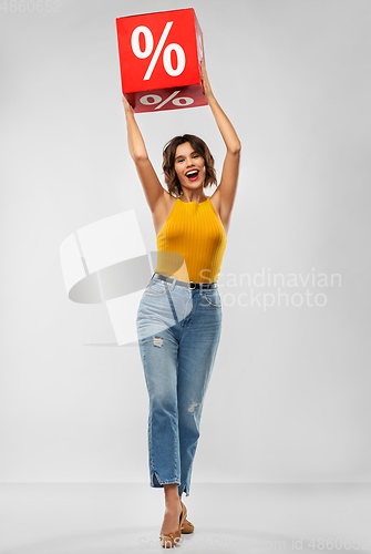 Image of happy smiling young woman with sale sign