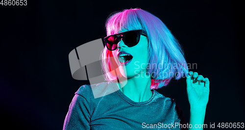 Image of happy woman in pink wig and black sunglasses